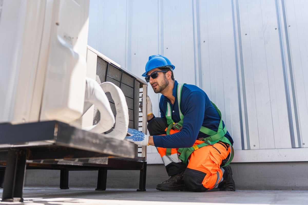 HVAC technician performing routine maintenance