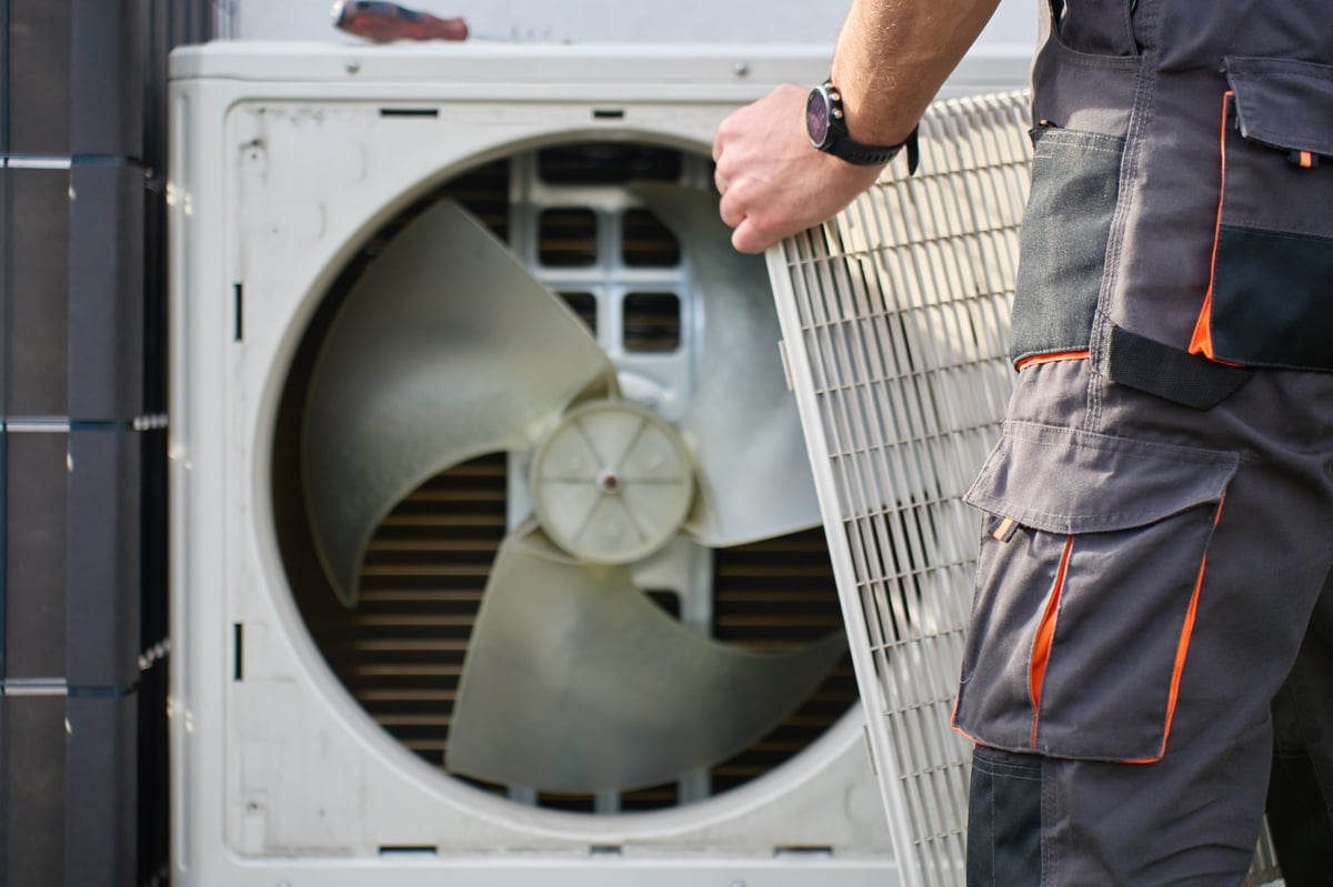 Clark's technician servicing a residential heat pump