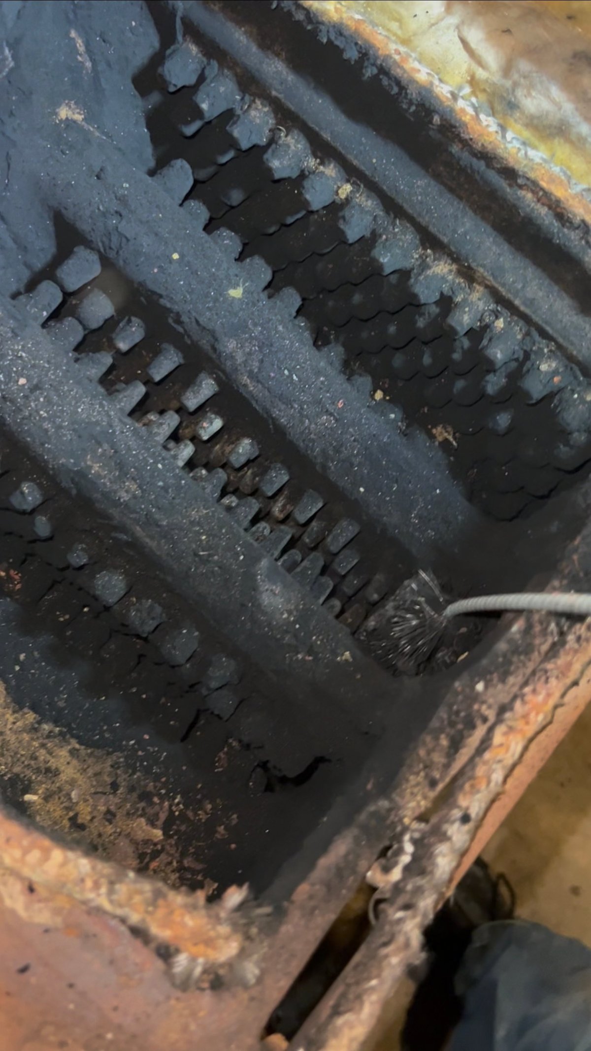 Worn metal gear teeth cleaned and serviced by Clark's Heating and Cooling during an HVAC maintenance visit